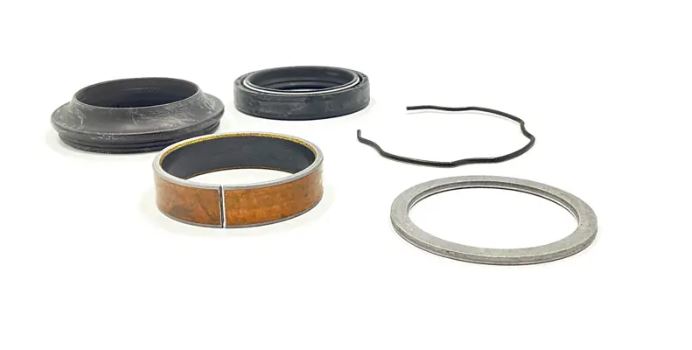 Kit Consists of 1 each of the following: PIC 1 (2) #11 Seal / Dust Cap (2) #12-Ring, Snap (2) #13 Seal / Oil (2) #14 Washer (2) #15 Slide, Metal